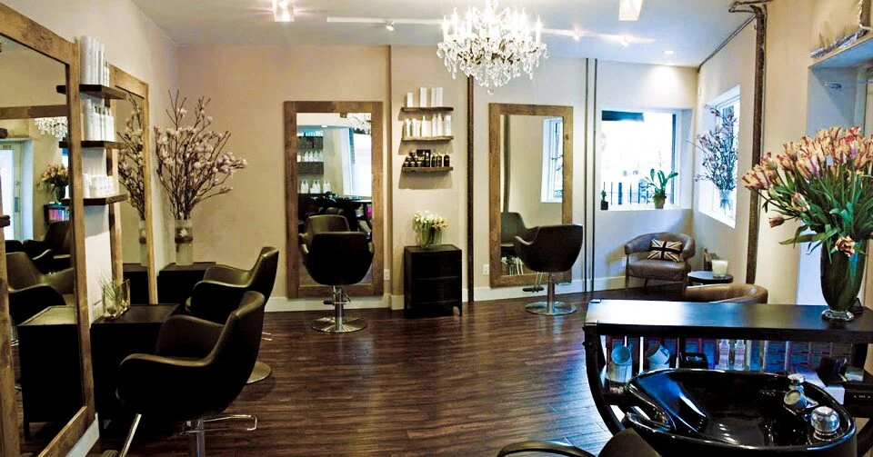 Inside Allure 13: styling chairs, tall mirrors, a chandelier and fresh flowers